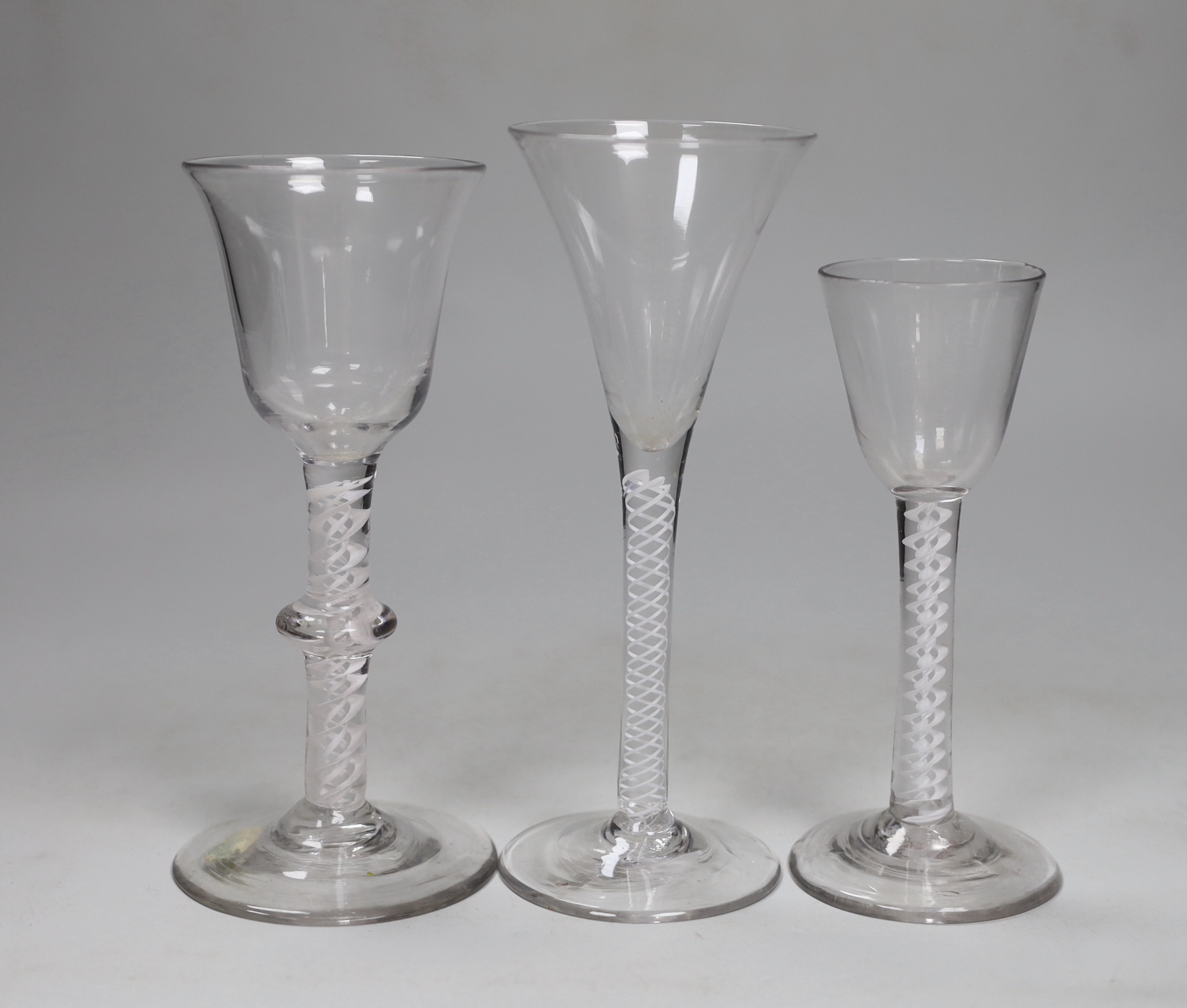 Three George III DSOT stem wine glasses, tallest 17.5cm high